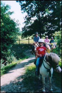 A Family enjoys a trail ride.....Priscilla, Don, Will, & Daisy.